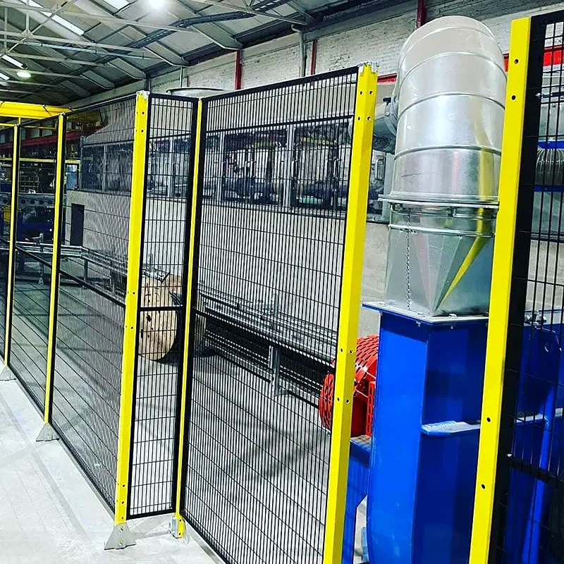 Automated manufacturing cell enclosed by industrial safety fencing
