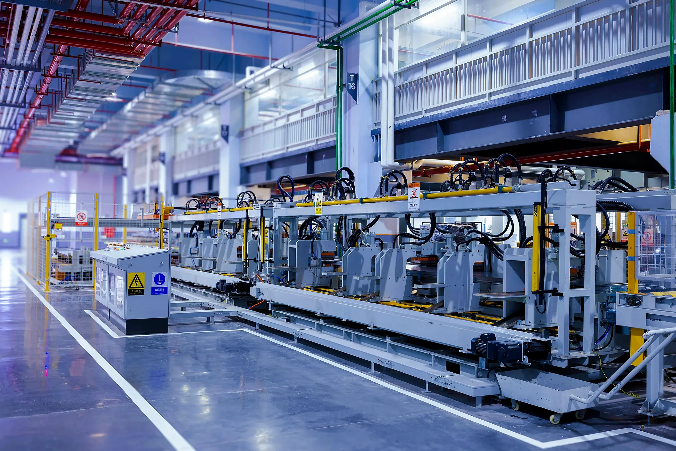 Automated industrial production area with robotics and conveyors