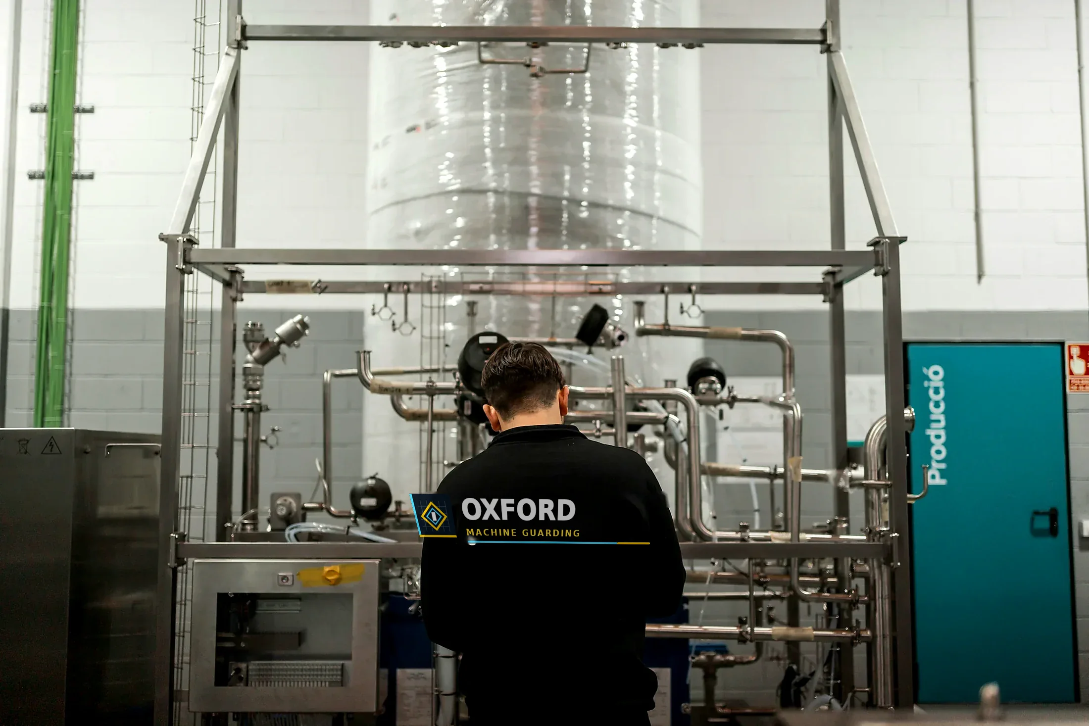 Oxford Machine Guarding engineer reviewing a customer production machine during a site survey